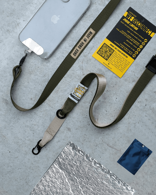 We Disconnect 2.0 Phone Lanyard (Army) - a yellow object